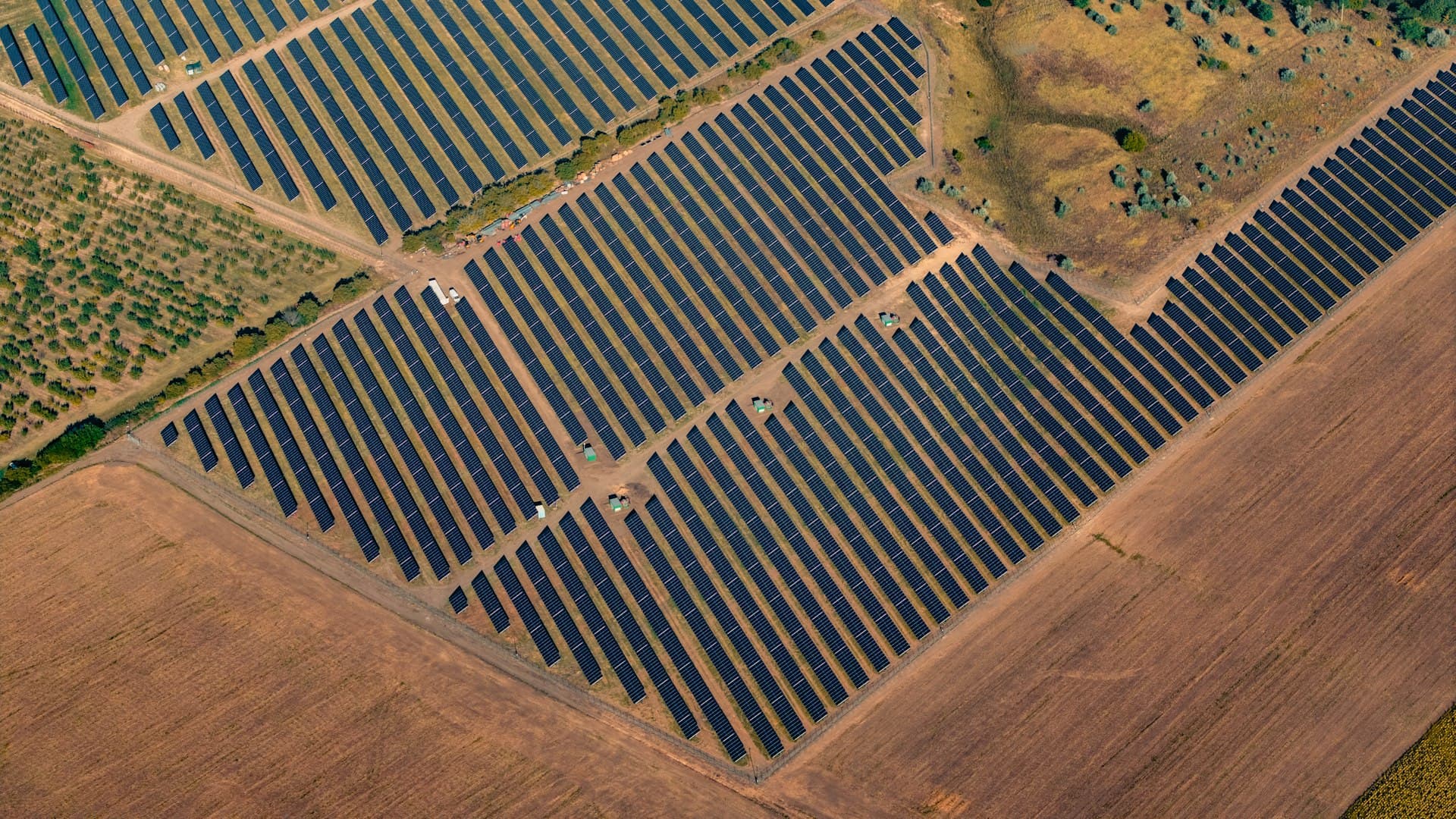 Rows of solar panels under a bright sky in Bangladesh
