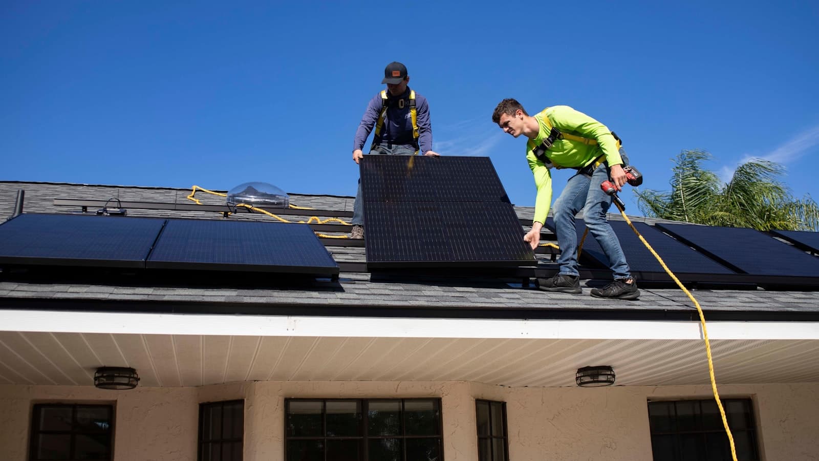CZ Engineering technicians installing a rooftop solar system